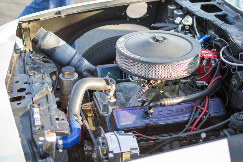 The driver side exhaust went under the engine to the passenger side where it met up and collected in the front-facing muffler.